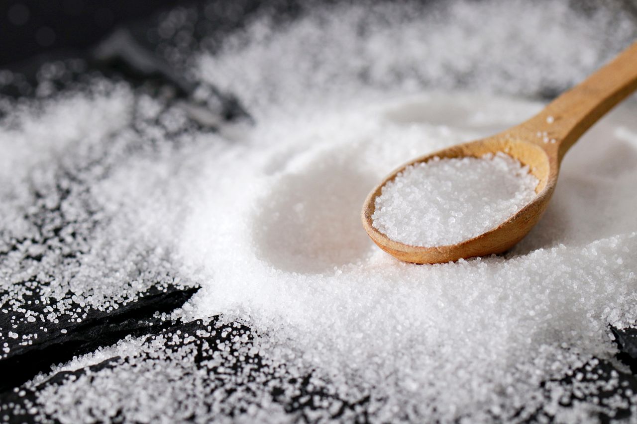 Mastering the First Impression: Your intriguing post title goes here A close-up view of fine sea salt in a wooden spoon, perfect for culinary uses.